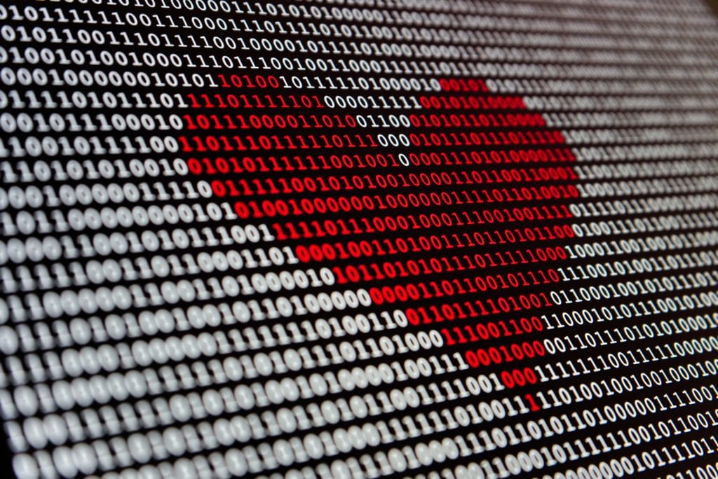 red heart made from binary code
